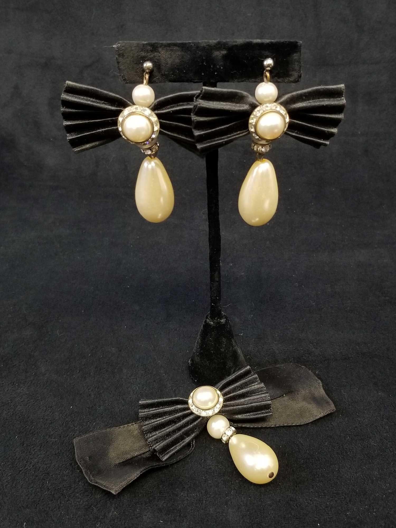 Art Deco Faux Pearl on Black Bow Dangle Drop Earrings and Brooch: This art deco faux pearl on black bow dangle drop earrings and brooch from 1985 are in good used condition. The Faux pearls do have some minor scratches and cuffing and the stones are all in tact. One