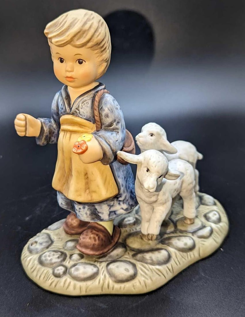 Goebel Hummel 1997 O Come All Ye Faithful Figurine: Goebel Hummel 1997 O Come All Ye Faithful Figurine. This is approximately 5" x 3" x 5". It comes in its original box that is approx 6 1/2" x 4 1/2" x 7 1/4" and it weighs 1lb.