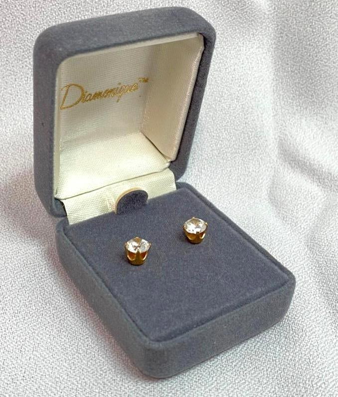Pair of Diamonique 14kt Gold CZ Stud Earrings: This piece of jewelry has been tested and researched prior to testing . Please view all our pictures they are part of our description. DETAILS: Metal - 14kt Gold Color - Yellow Gold Stones - CZ Hallm