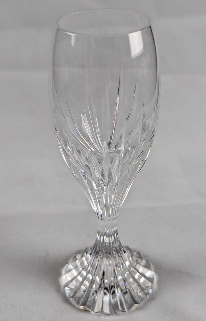 Baccarat Crystal Massena Liqueur Cordial Glass: The Massena glass showcases Baccarat’s meticulous craftsmanship. Deep orgue bevel cuts are etched directly into the clear crystal, radiating from the foot of the glass to the base of the wide bowl. 
