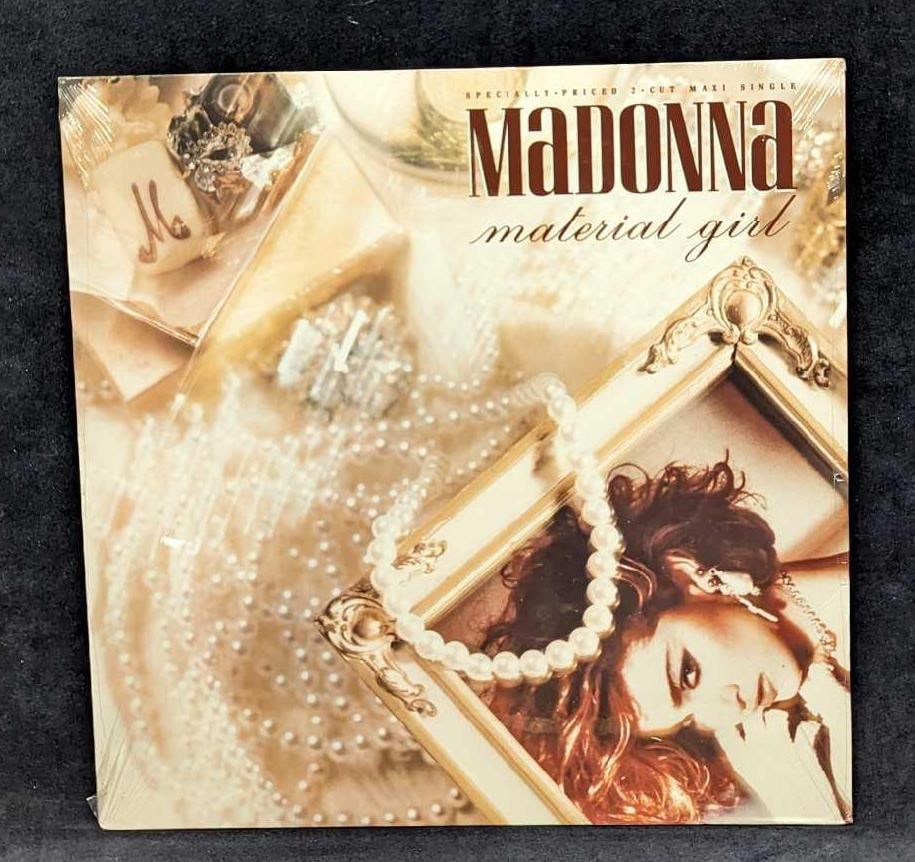 Sealed Madonna Material Girl Sire Maxi Single LP: Sealed Madonna Material Girl Sire Maxi Single LP. This was released by Sire in 1985. This sealed LP is approx 12 3/8" x 12 3/8" and it weighs 0.42lb.