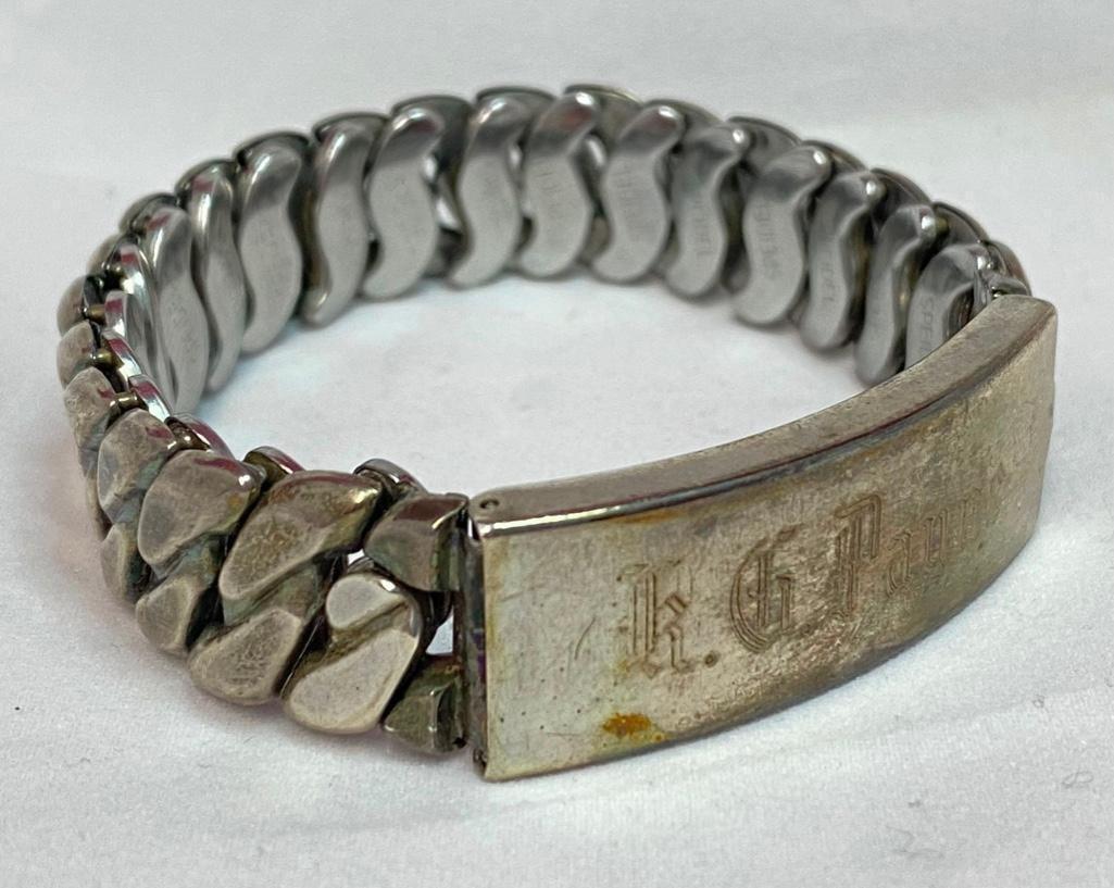 Sterling and Stainless Stretch Locket Bracelet: This piece of jewelry as been tested and researched prior to testing . Please view all our pictures they are part of our description. DETAILS: Metal - Sterling Silver Color - Silver Stones - none