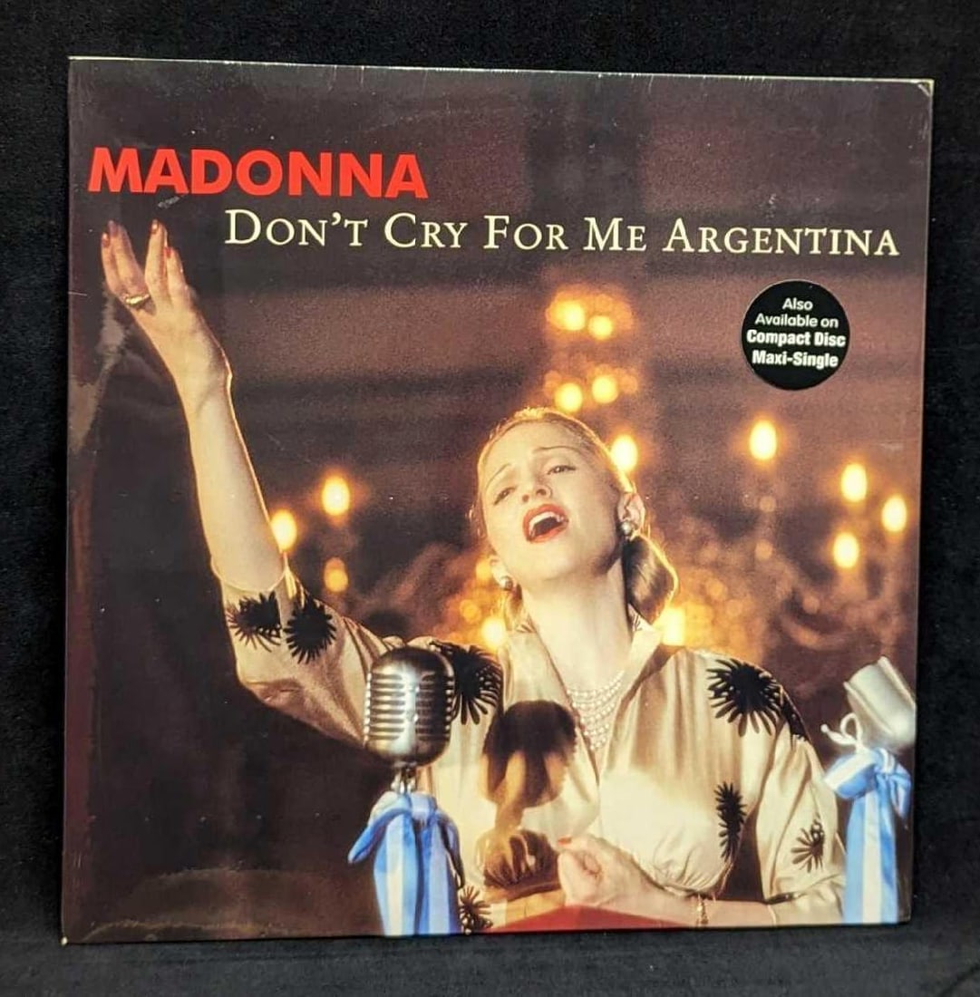Sealed Madonna Don't Cry For Me Argentina Mix LP: Sealed Madonna Don't Cry For Me Argentina Mix LP. This was released by Warner Bro Records in 1997. This is approx 12 3/8" x 12 3/8" and it weighs 0.43lb. The sealed LP has some wear and st