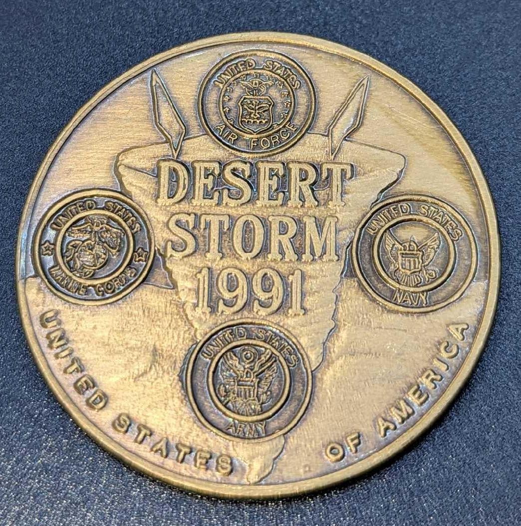 Brass Desert Storm 1991 Challenge Coin USA F18: Brass Desert Storm 1991 Challenge Coin USA F18. It comes in its original package that is approx 3" x 2 1/2" x 1/8" and it weighs 0.08lb. The coin has light wear and there is a scratch on t