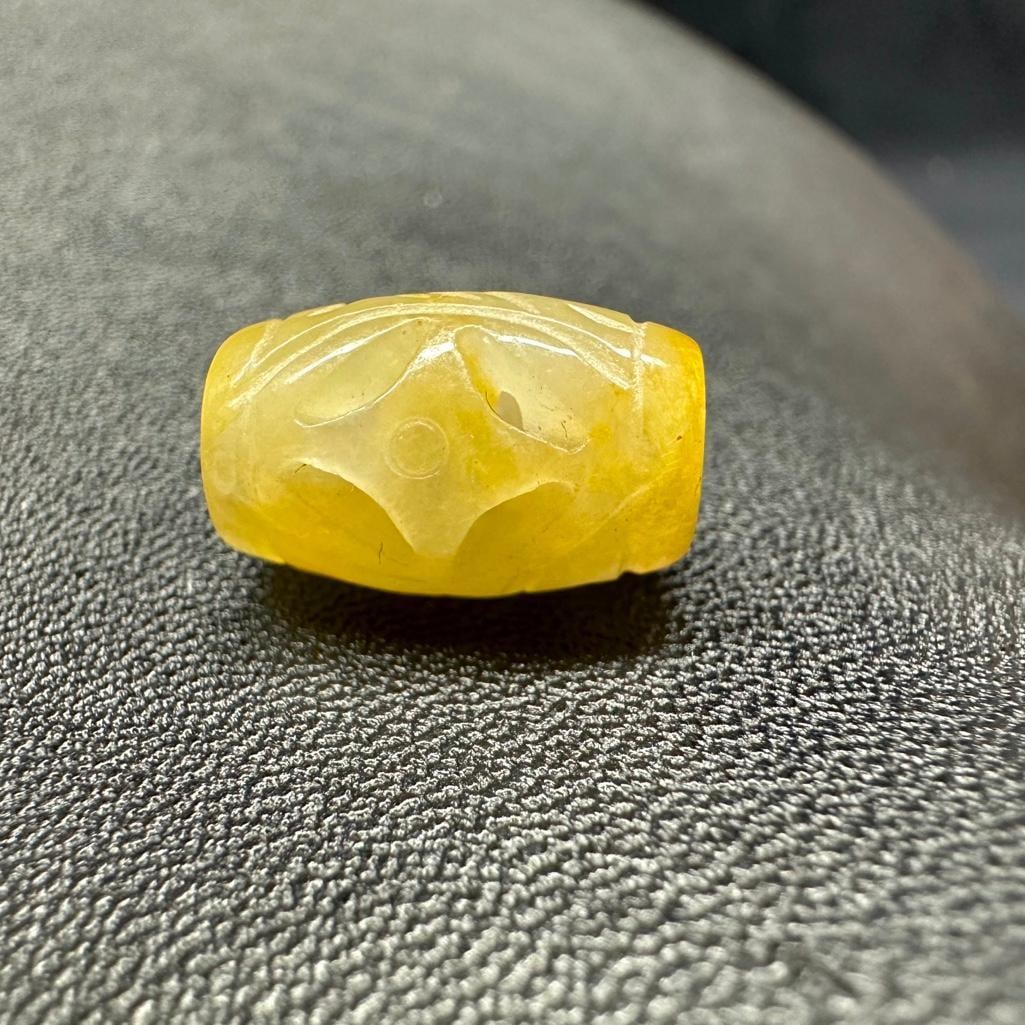 Carved Yellow White Jadeite Barrel Bead: This piece of jewelry has been tested and researched prior to listing. Please view all our pictures they are part of our description. DETAILS: Metal - none Color - White & Yellow Stones - Jadeite