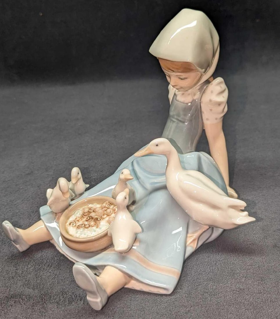 Retired Lladro Girl Saucepan And Duck Figurines: Retired Lladro Girl Saucepan And Duck Figurines. This was designed by Juan Huerta and was released from the year 1980 to the year 1998. The figurine is approximately 7 1/2" x 7" x 6 1/2" a