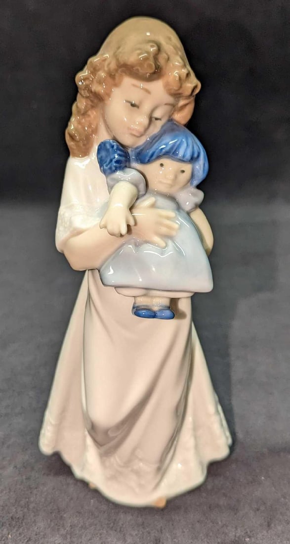 Lladro Nao Girl With Rag Doll We’re Sleepy Figurine B: Lladro Nao Girl With Rag Doll We’re Sleepy Figurine B. This is approx 4" x 3" x 8 1/2" and it weighs 0.90lb. The figurine has no chips or cracks.