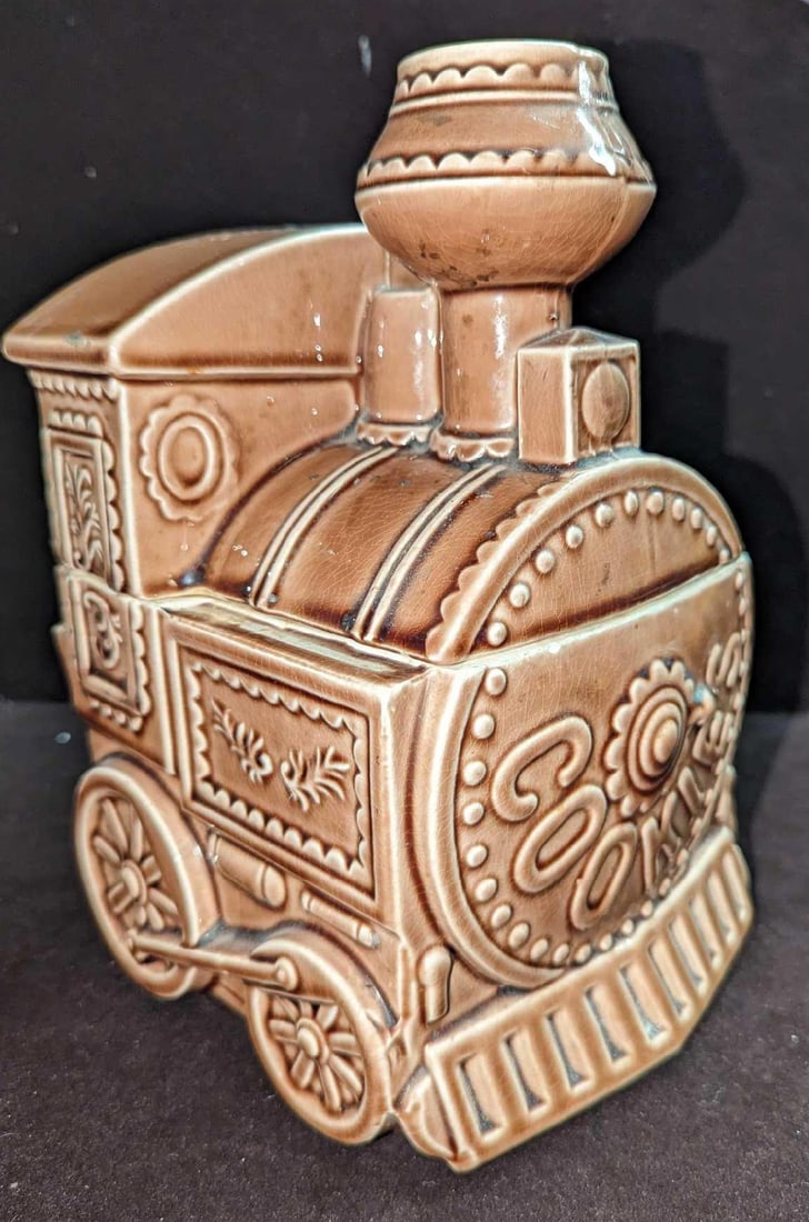 Ceramic Cookie Train Jar From Japan: Ceramic Cookie Train Jar From Japan. This is approx 6 1/2" x 6 1/4" x 9 1/2" and it weighs 3.19lbs. The cookie jar has some crazing and some small chips. Please see the images as they are