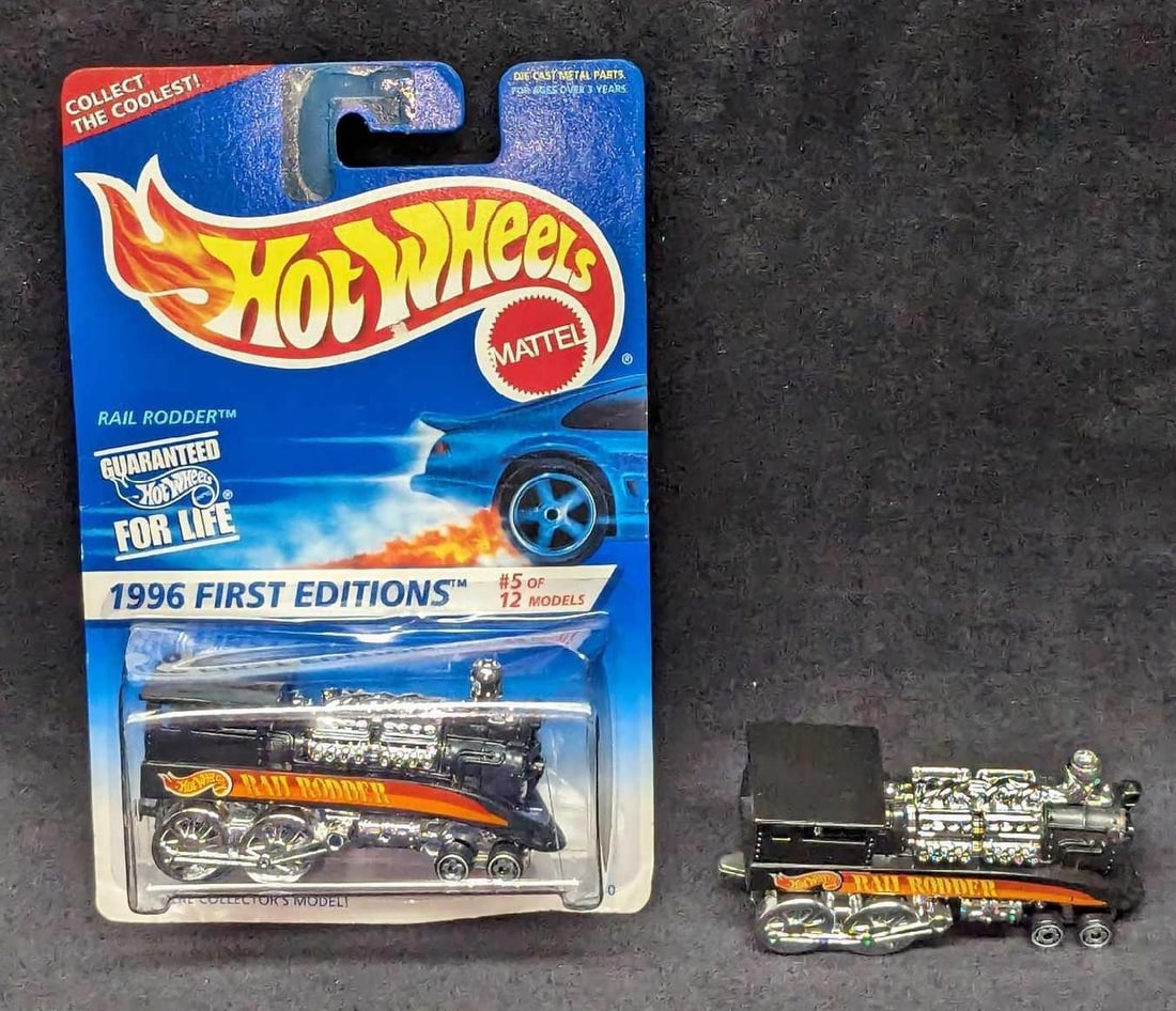 2 Hot Wheels 1996 First Editions Rail Rodder: 2 Hot Wheels 1996 First Editions Rail Rodder. One comes in its original box that is approx 4 1/4" x 1 1/2" x 6 1/2". One does not come with the box, this is approx 3" x 1 1/4" x 1