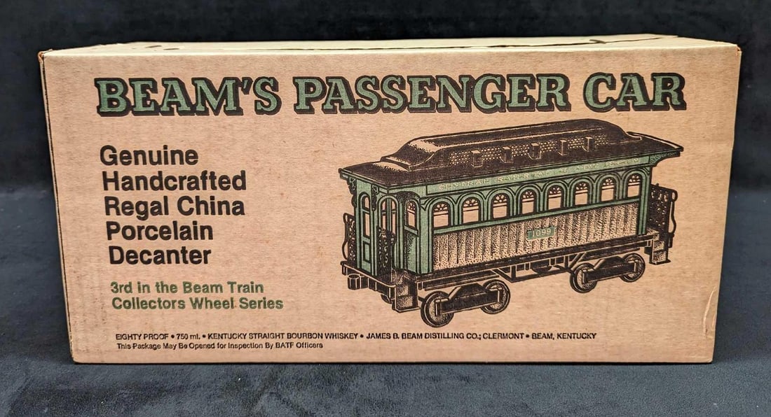 Sealed Jim Beam's Passenger Car Porcelain Decanter: Sealed Beams Passenger Car Porcelain Decanter. This decanter has never been removed from its box and the box is still sealed. The original box is approx 18" x 6 1/2" x 8 5/8" and it weighs