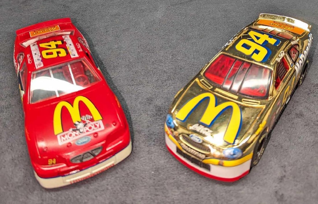 2 1/24th McDonald's Bill Elliott Stock Cars Monopoly: 2 1/24th McDonald's Bill Elliott Stock Cars Monopoly. This lot includes: (1) Racing Champions 1/24th Diecast Gold McDonald's #94 Bill Elliott Stock Car. This is approx 3" x 8" x 2 1/4