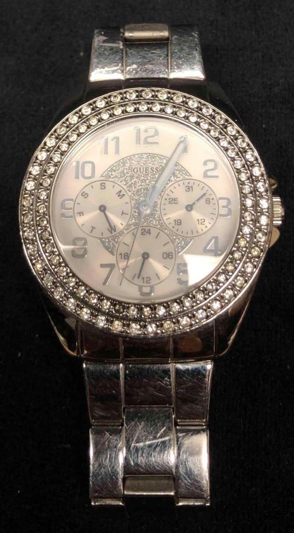 Authentic Guess Silver Tone Stainless Steel Watch G11040L: This lot contains an authentic Guess silver tone stainless steel watch G11040L. The watch was made in China and is water resistant up to 100 meters or 330 feet. It is approx 2 1/2" x 1/2" and