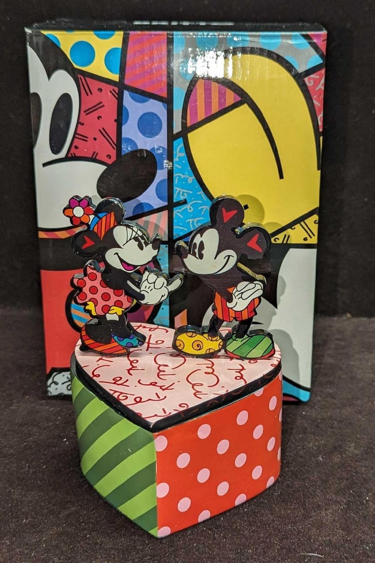 Mickey & Minnie Heart Box - Disney By Britto: Mickey & Minnie Heart Box - Disney By Britto. This comes in its original box that is approx 5 3/8" x 5 3/8" x 7 1/4" and it weighs 0.77lb. The lidded box is approx 3 1/2" x 3 1/2&#