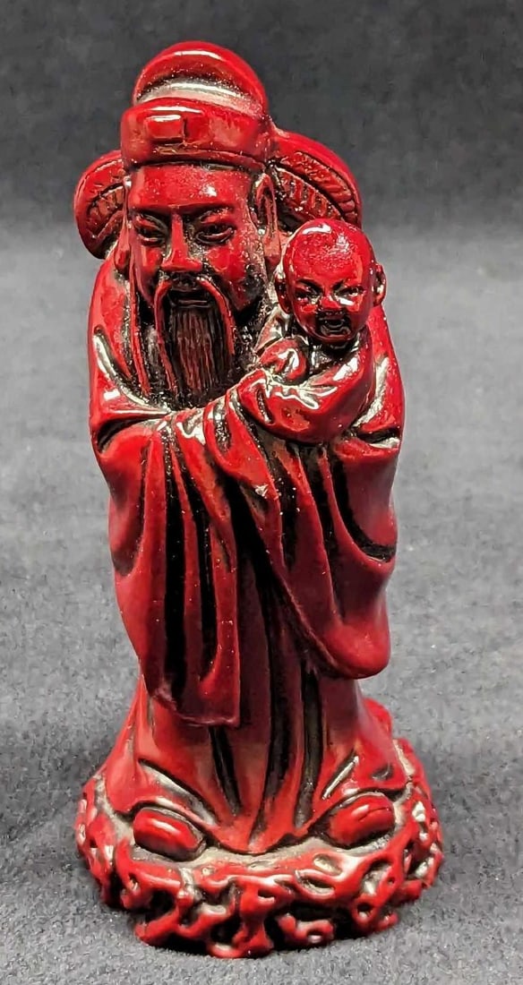 Feng Shui Fuk Star God Red Stone Resin Figurine: Feng Shui Fuk Star God Red Stone Resin Figurine. Fuk deity symbolizes family happiness, fulfillment, good relationships, and mutual love. He carries an imperial scroll and sometimes children with him.