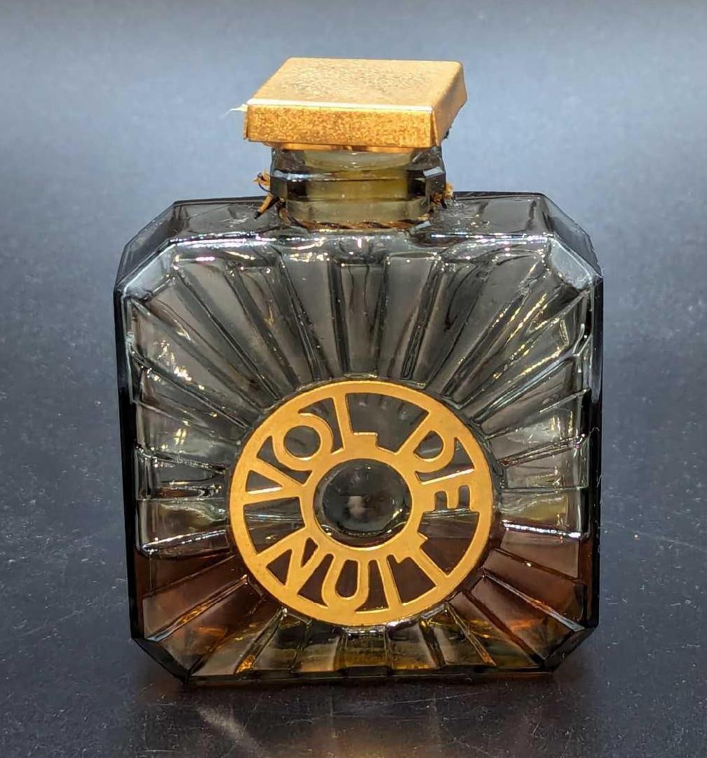 Vintage Vol De Nuit Guerlain Parfume Bottle: Vintage Vol De Nuit Guerlain Parfume Bottle.This is approx 2 5/8" x 1" x 3 1/2" and it weighs 0.32lb. There is still perfume in the bottle. Please see the images as they are part of the de