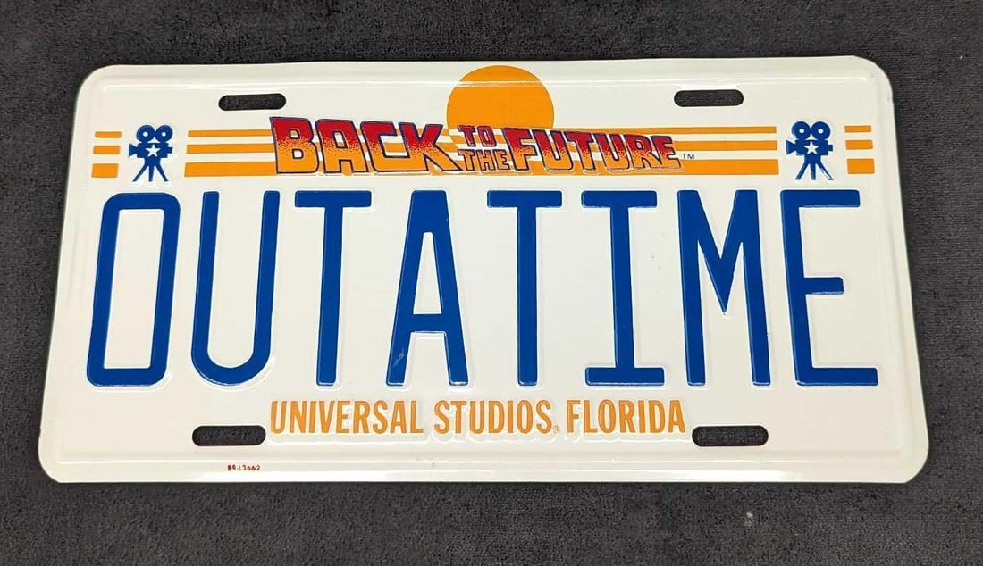 Back to the Future OUTATIME License Plate: Back to the Future OUTATIME License Plate. The metal plate is approx 11 7/8" x6" and it weighs 0.15lb. The plate has some markings. Please see the images as they are part of the description. F