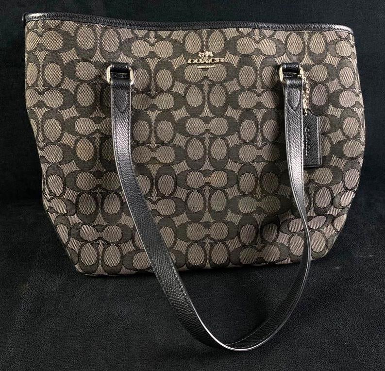 Gray Coach Signature Monogram Bag: Gray Coach Signature Monogram Bag Coach monogram bag in gray from the signature collection in good condition, with silver hardware. The bag features a zipper pocket on both the inside and outside of