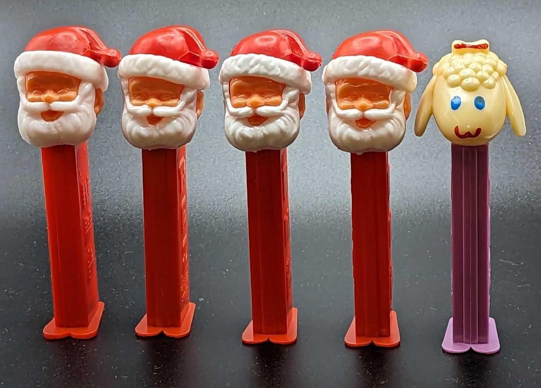 5 Vintage Santa Claus & Lamp Chop Pez Dispensers: 5 Vintage Santa Claus & Lamp Chop Pez Dispensers. This lot includes: (3) Vintage Santa Claus Pez Dispensers From Yugoslavia. (1) Vintage Santa Claus Pez Dispenser From Slovenia. This has a small