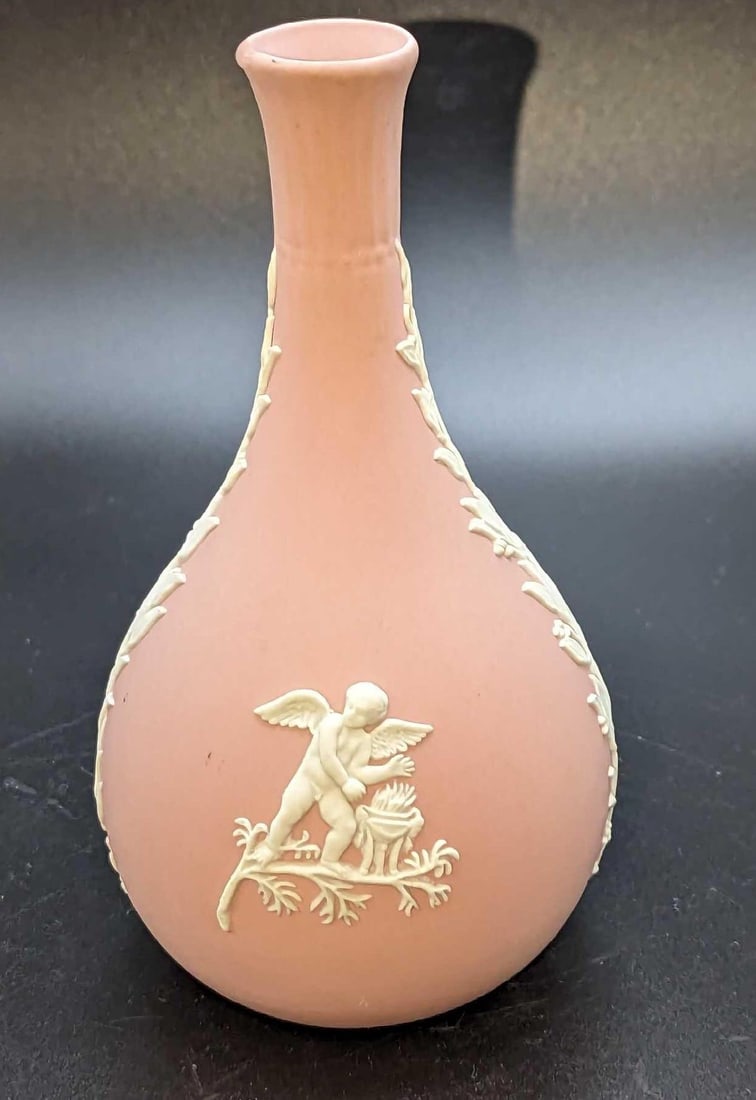 Vintage Wedgwood Pink Jasperware Seasons Bud Vase: Vintage Wedgwood Pink Jasperware Seasons Bud Vase. This is approx 3" x 3" x 5 1/2" and it weighs 0.32lb. There are some light markings on the vase and a small pink spot near the middle of