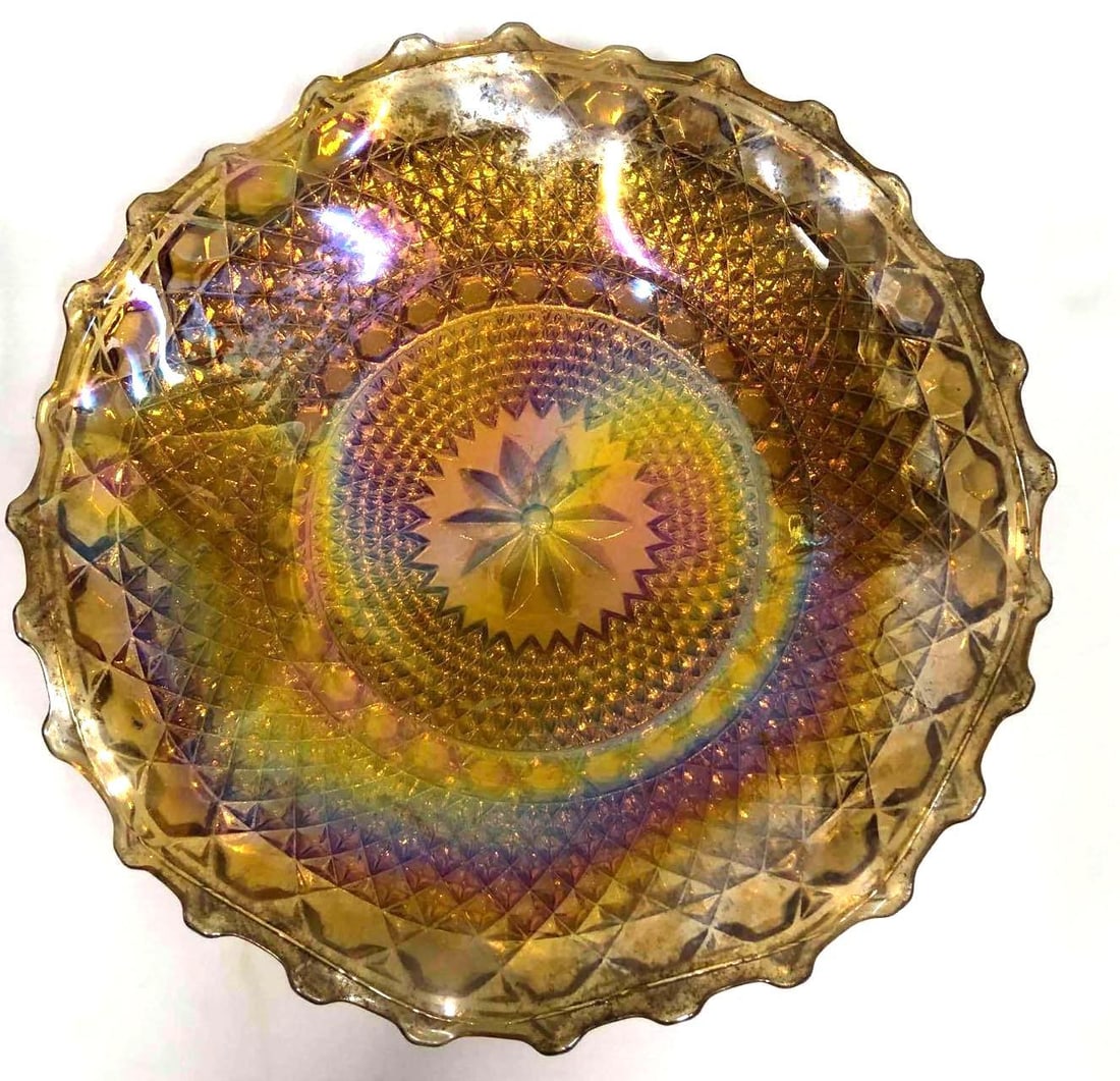 Vintage Amber Iridescent Carnival Glass: This lot contains a vintage gold iridescent carnival glass. It is approx 10 1/4" x 10 1/4" x 1 3/4" and weighs about 2lbs. Overall the carnival glass is in good used condition with some li
