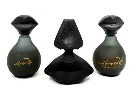Three Vintage Mini Salvador Dali Perfume Bottles: This lot contains Three Mini Salvador Dali Perfume Bottles. The matching bottles are each 1" x 1" x 2 1/4" while the other bottle is approx 1 3/4" x 1" x 2". Total weight is ap