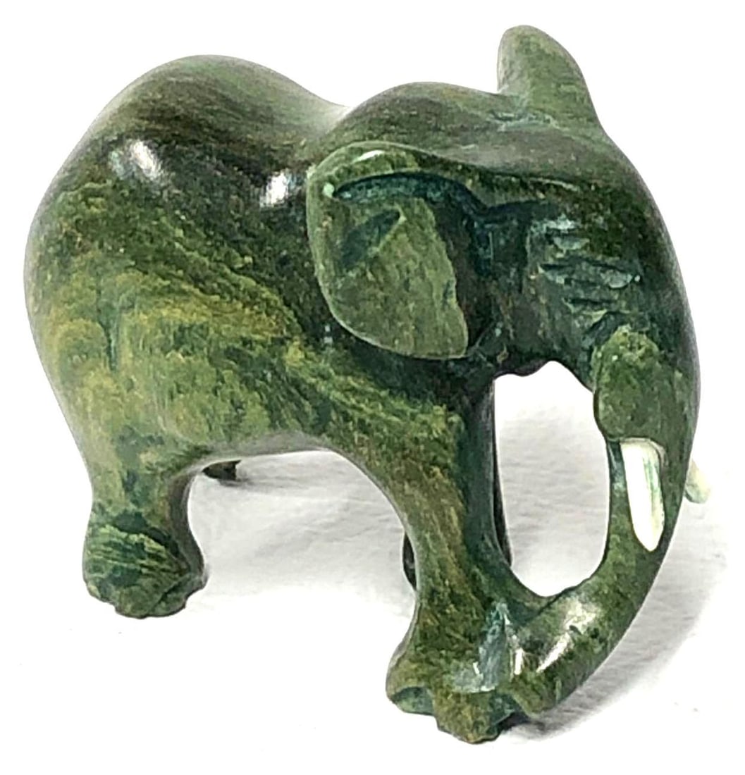 Mini Elephant Sculpture - Verdite a.k.a. Buddstone or South African Jade: Miniature Elephant Sculpture Carved from Verdite a.k.a. Buddstone or South African Jade. This natural crystal is believed to have healing properties and works on all chakras. The item measures approxi