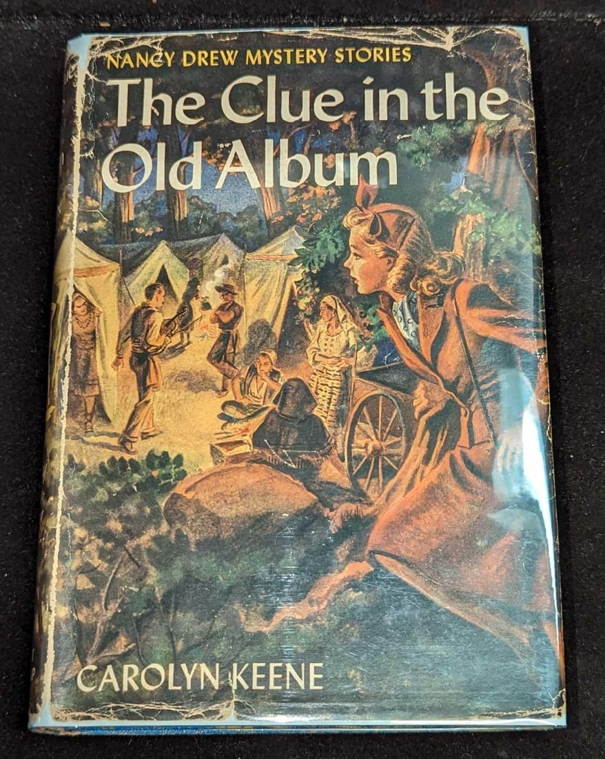 Nancy Drew #24 "The Clue In The Old Album" 1947 Dust Jacket First Edition: Nancy Drew #24 "The Clue In The Old Album" 1947 Dust Jacket First Edition. This is approx 5 1/4" x 1" x 7 3/4" and it weighs 0.65lb. The dust jacket has some shelf wear. This was w