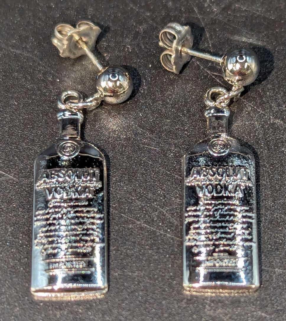 Rare Absolut Vodka Silver Plated Earrings? D: Rare Absolut Vodka Silver Plated Earrings? D. Each is approx 1/4" x 1 3/4" and it weighs 6g. Both are in an unused condition with no known damage. Please see the images as they are part of the
