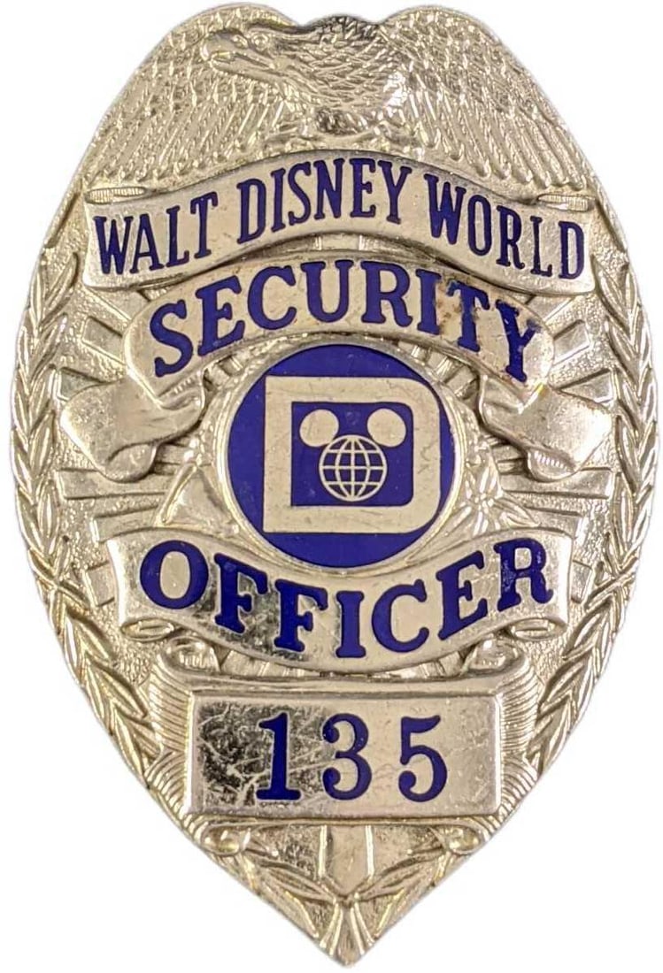 Early 1980s Disney World Security Metal Badge: Early 1980s Disney World Security Metal Badge. Is approx 2 1/4" x 3/4" x 3" and it weighs under one pound at 0.15lb. The metal badge is in a good, vintage condition with some wear and mini