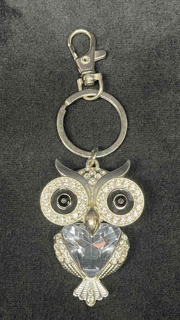 Owl Keychain: This lot contains a Owl Keychain. The keychain is approx 4 3/4" x 1 3/4" x 1/2" and it weighs about 0.09lbs. Overall the keychain is in good used condition with some light wear from use ov