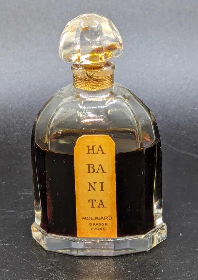 Vintage Molinard Paris Habania Baccarat Bottle: Vintage Molinard Paris Habania Baccarat Bottle. This is approx 2 1/4" x 1 1/4" x 3 1/2" and it weighs 0.26lb. The bottle is filled halfway. The bottle has no chops or cracks.