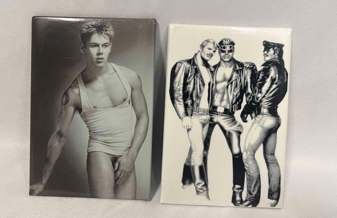 Two Collectible Magnets From The Tom Of Finland Foundation: This lot contains Two Collectible Magnets From The Tom Of Finland Foundation. Each magnet is approx 3 1/4" x 2 1/4". Total weight is 2.1oz. Overall the Magnets are in good used condition with 