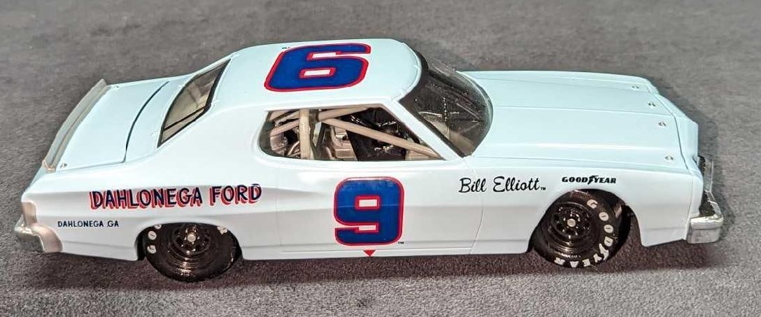 Bill Elliott Dahlonega Ford Torino NASCAR Diecast: Bill Elliott Dahlonega Ford Torino NASCAR Diecast. This is approx 3 1/4" x 8 1/2" x 2 1/2" and it weighs 1.63lb. There is some light wear on the car.