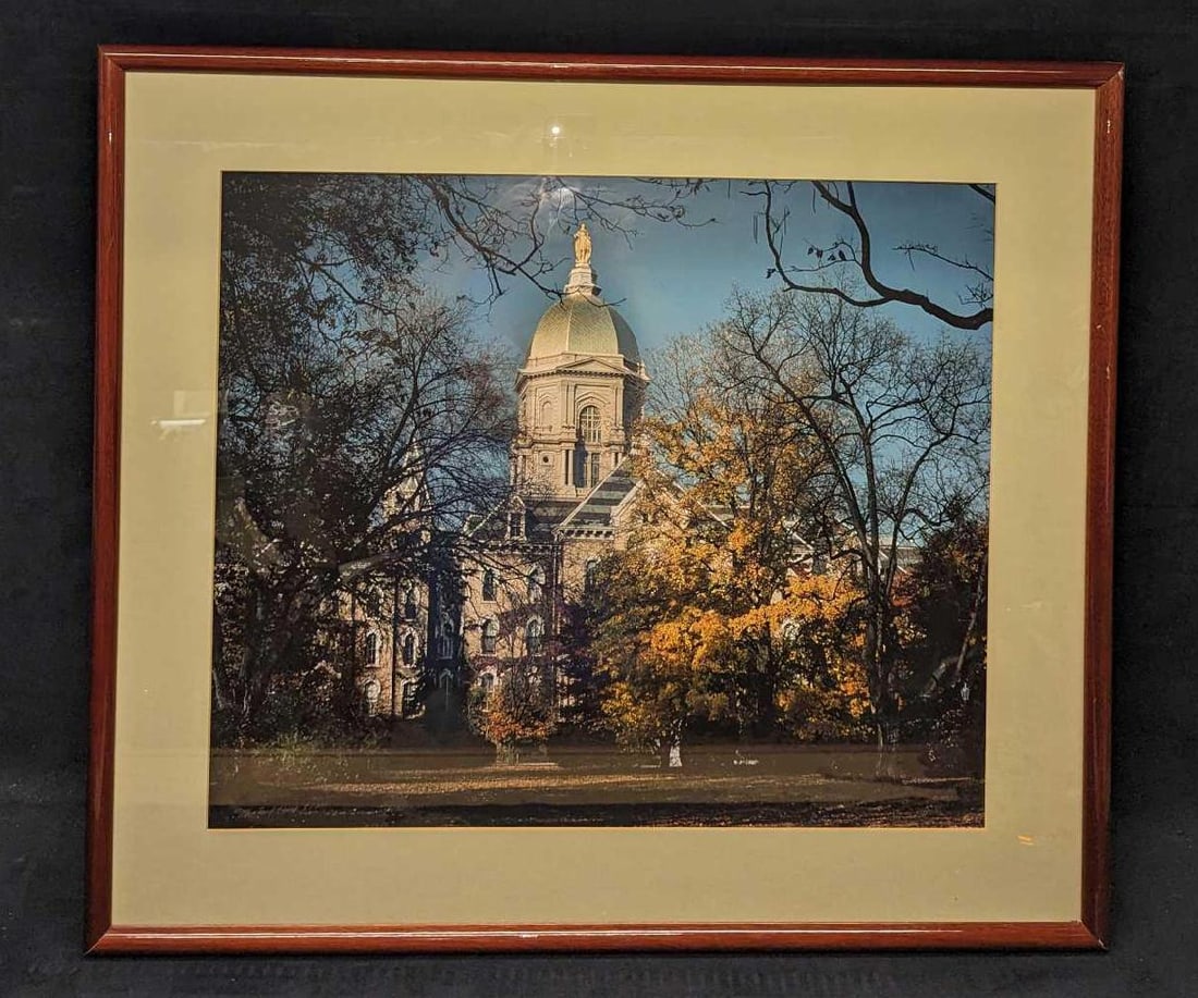 Framed S&N University Of Notre Dame Main Building: Framed S&N University Of Notre Dame Main Building. This one is #8 out of #100. The photo print is signed by the bottom left by the photographer, Michael Hart. The framed photo print is approx 30 3