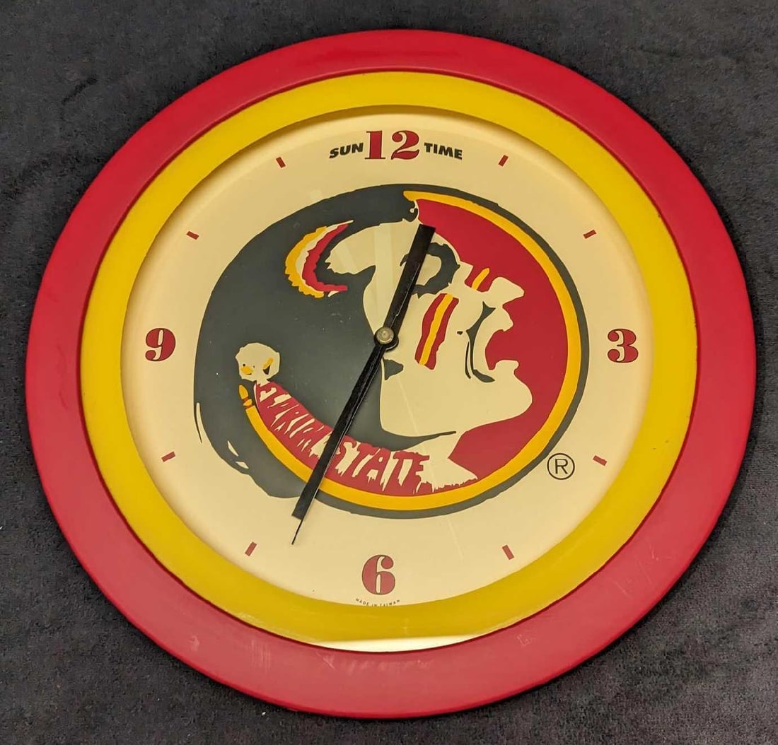 FSU Florida State University Seminoles College Clock: FSU Florida State University Seminoles College Clock. By Shontek. This hard plastic clock is approximately 11 1/2" x 1 1/4" x 11 1/2" and it weighs 1.26lb. The clock was tested and it work