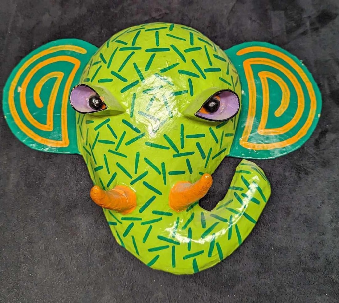Gina Truex Paper Mache Elephant Wall Art Mask: Gina Truex Paper Mache Elephant Wall Art Mask. This is approx 13 1/2" x 4" x 10" and it weighs 0.36lb. There are some chips in the right eye and left ear. Please see the images as they are