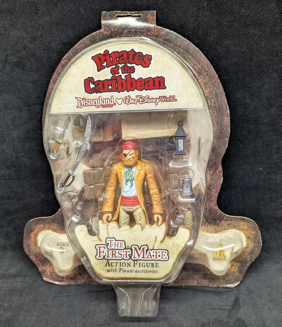 Disney Pirates Of The Caribbean First Mate Action Figure: Disney Pirates Of The Caribbean First Mate Action Figure. The sealed figure comes with two kitties and "pirate accessories". Comes in its original package that is approx 12 5/8" x 3" x