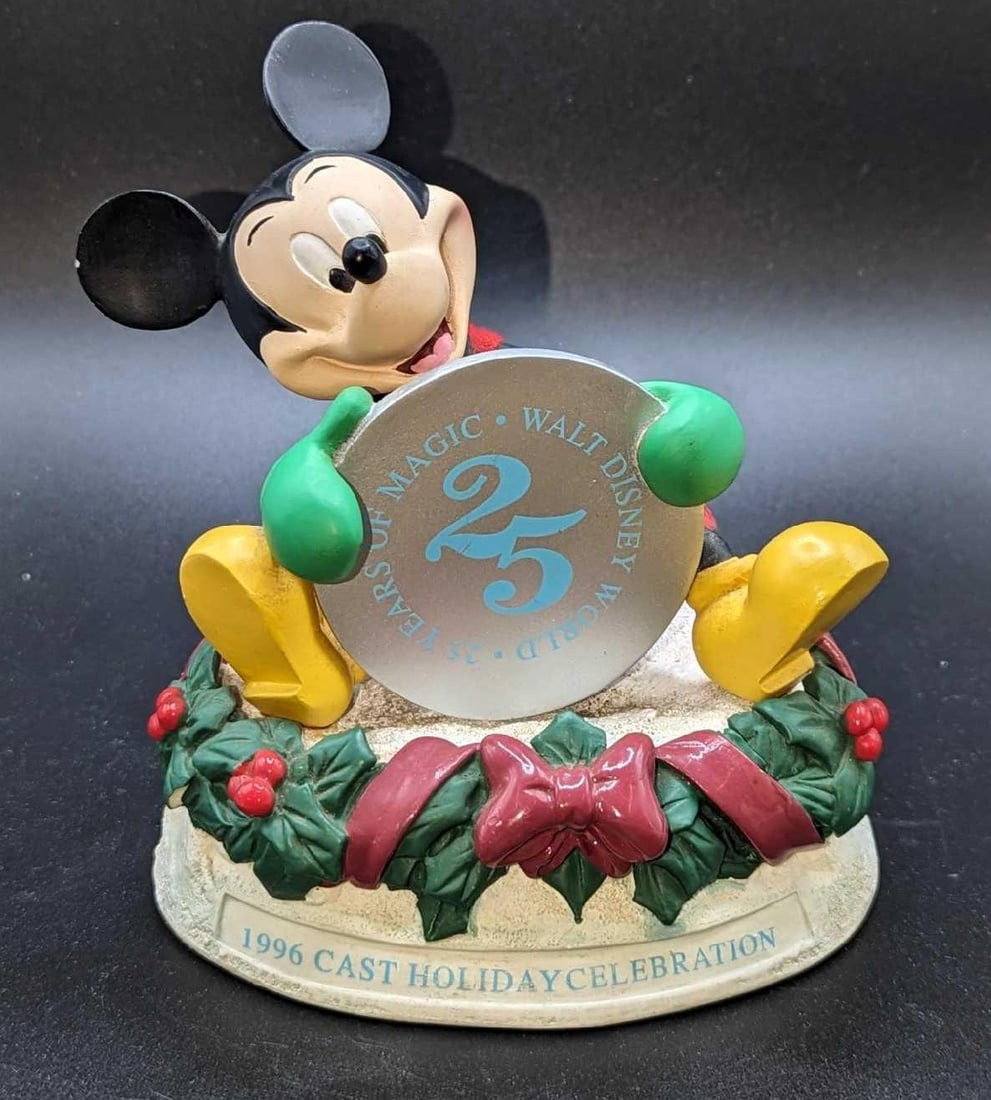 25 Years Of Magic Walt Disney World 1996 Cast Holiday Celebration Figurine: 25 Years Of Magic Walt Disney World 1996 Cast Holiday Celebration Figurine. This lot contains 25 Years Of Magic Walt Disney World 1996 Cast Holiday Celebration Figurine. It is approx 5" x 4" x