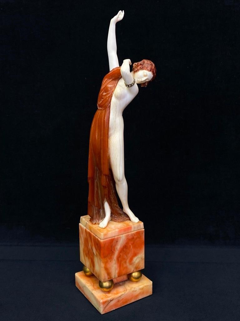 Antique "Carved Bone" Woman With Alabaster Base: Antique "Carved Bone" Woman With Alabaster Base Art Nouveau/Art Deco transitional piece, depicting a woman in carved bone, partially covered with an amber toga, and an alabaster base that fea
