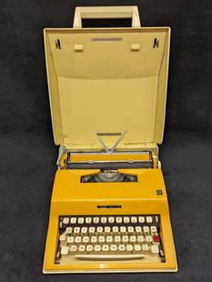 Vintage Montgomery Ward Escort 55 Typewriter: Vintage Montgomery Ward Escort 55 Typewriter. This typewriter was based on the popular Olivetti Lettera 32 model but was offered in bold bright colors and a durable ABS plastic body. These were made i