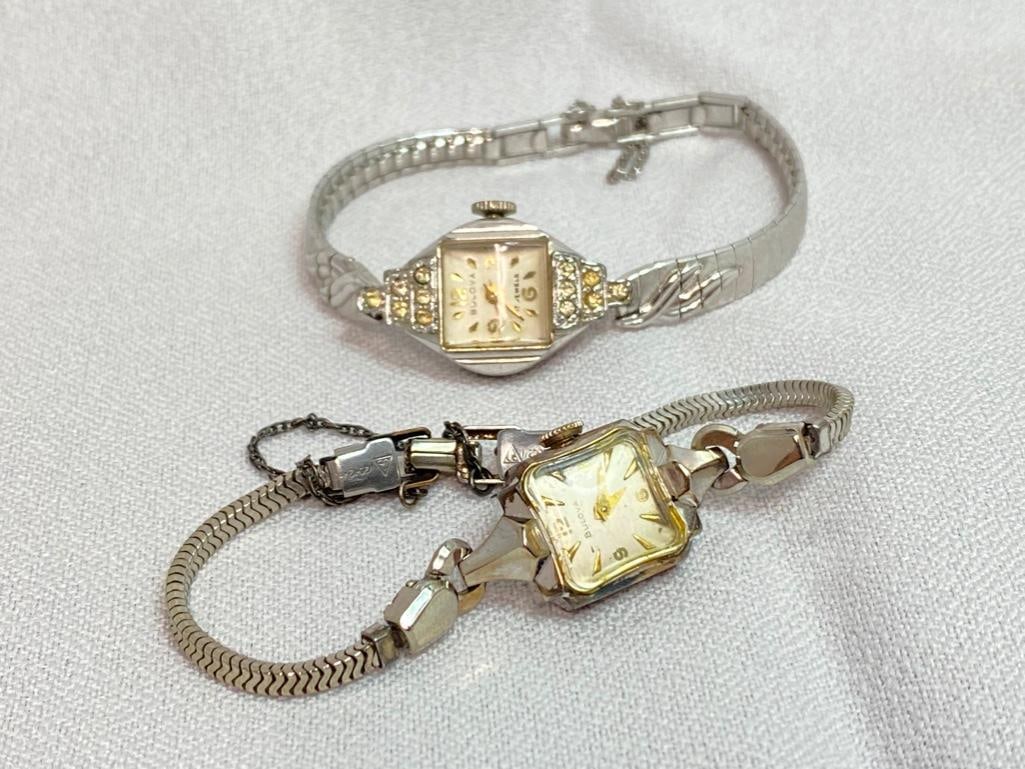 Two Vintage Bulova Ladies Watches: This piece of jewelry has been tested and researched prior to testing . Please view all our pictures they are part of our description. DETAILS: Metal - Gold plated base metal Color - silver Stones - C