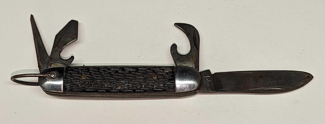 Vintage Sabre Multi Tool Pocket Knife: Vintage Sabre Multi Tool Pocket Knife. Is approx 3/4" x 4 1/2" x 3/4" and it weighs 0.18lb. Has signs of wear and light surface rust.