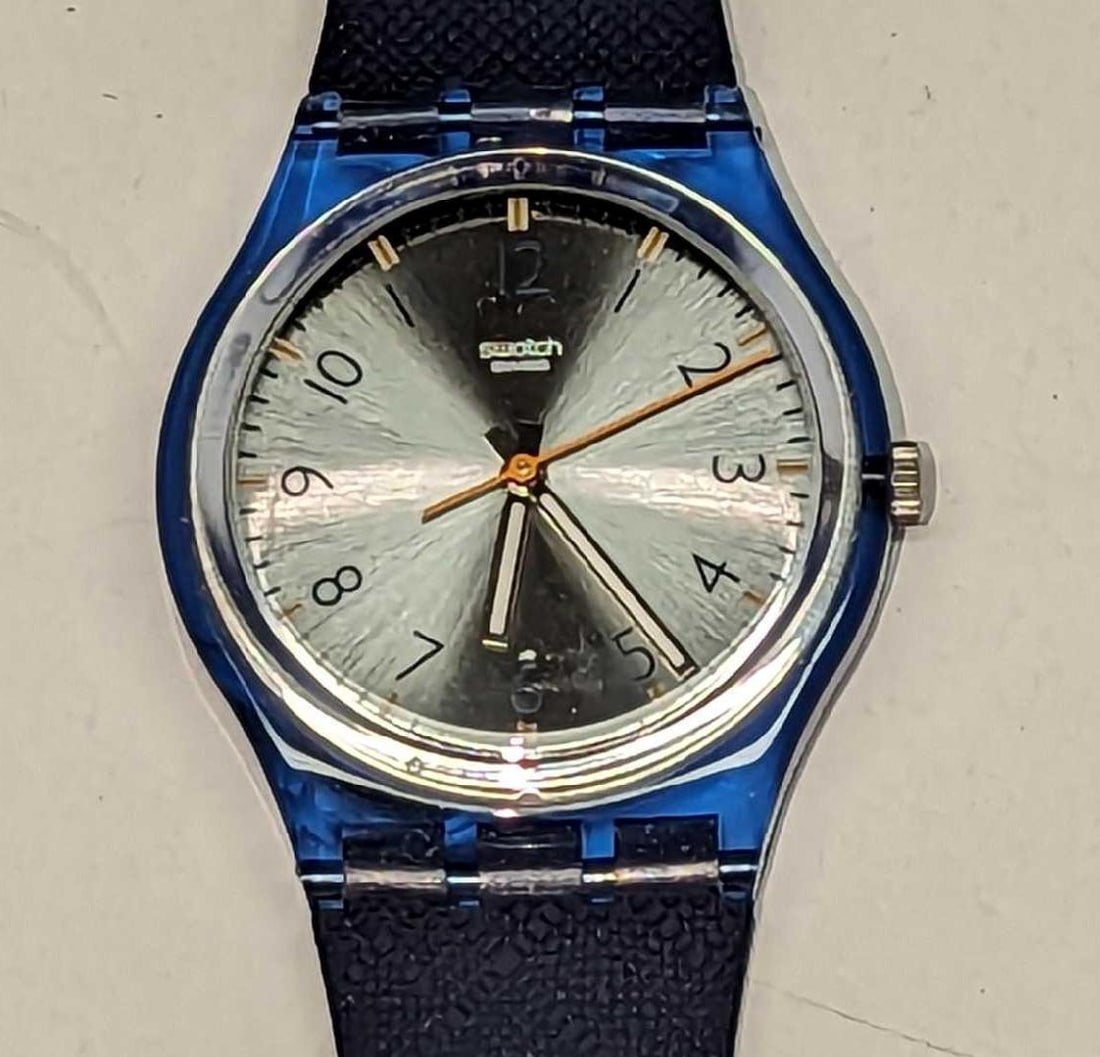 Dark Blue Swatch Watch: Dark Blue Swatch Watch. It comes in its original box which is approx 1 3/4" x1" x 10" and it weighs 0.19lb. There are markings on the band and the watch requires a new battery. Movement: