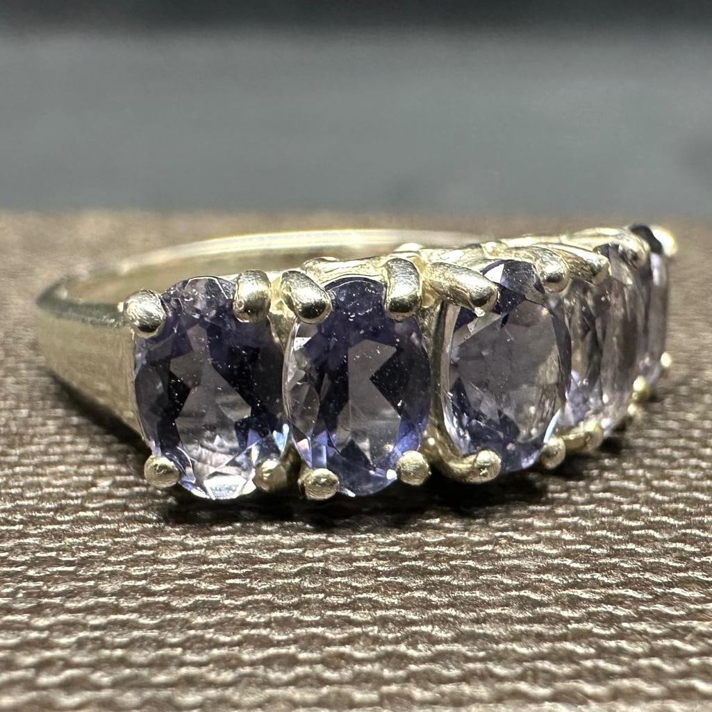 5-Stone Tanzanite Sterling Ring: This piece of jewelry has been tested and researched prior to listing. Please view all our pictures they are part of our description. DETAILS: Metal - Sterling Silver Color - Silver Stones - Tanzanite
