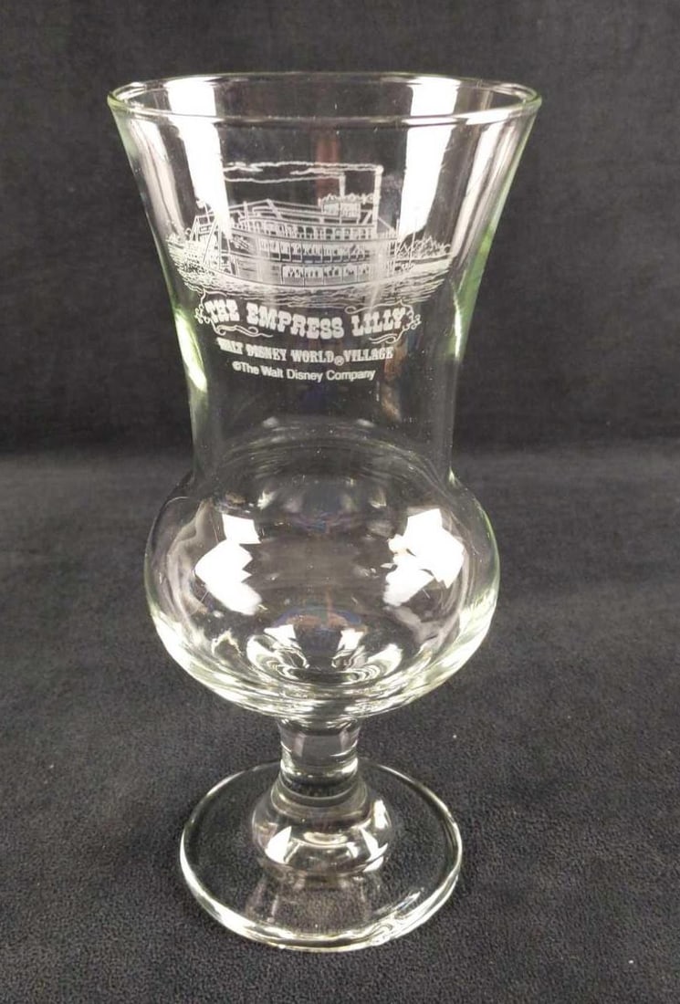 Vintage Empress Lilly Hurricane Glass: Here is one vintage Empress Lilly Hurricane Glass. It was originally sold at the now-closed Empress Lilly restaurant that operated at the Disney Village (now Disney Springs) from 1976 to 1995. The res