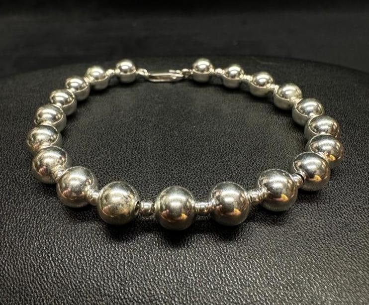 Sterling Silver Bead Over Chain Bracelet: This piece of jewelry has been tested and researched prior to listing. Please view all our pictures they are part of our description. DETAILS: Metal - Sterling Silver Color - Silver Stones - none Hall
