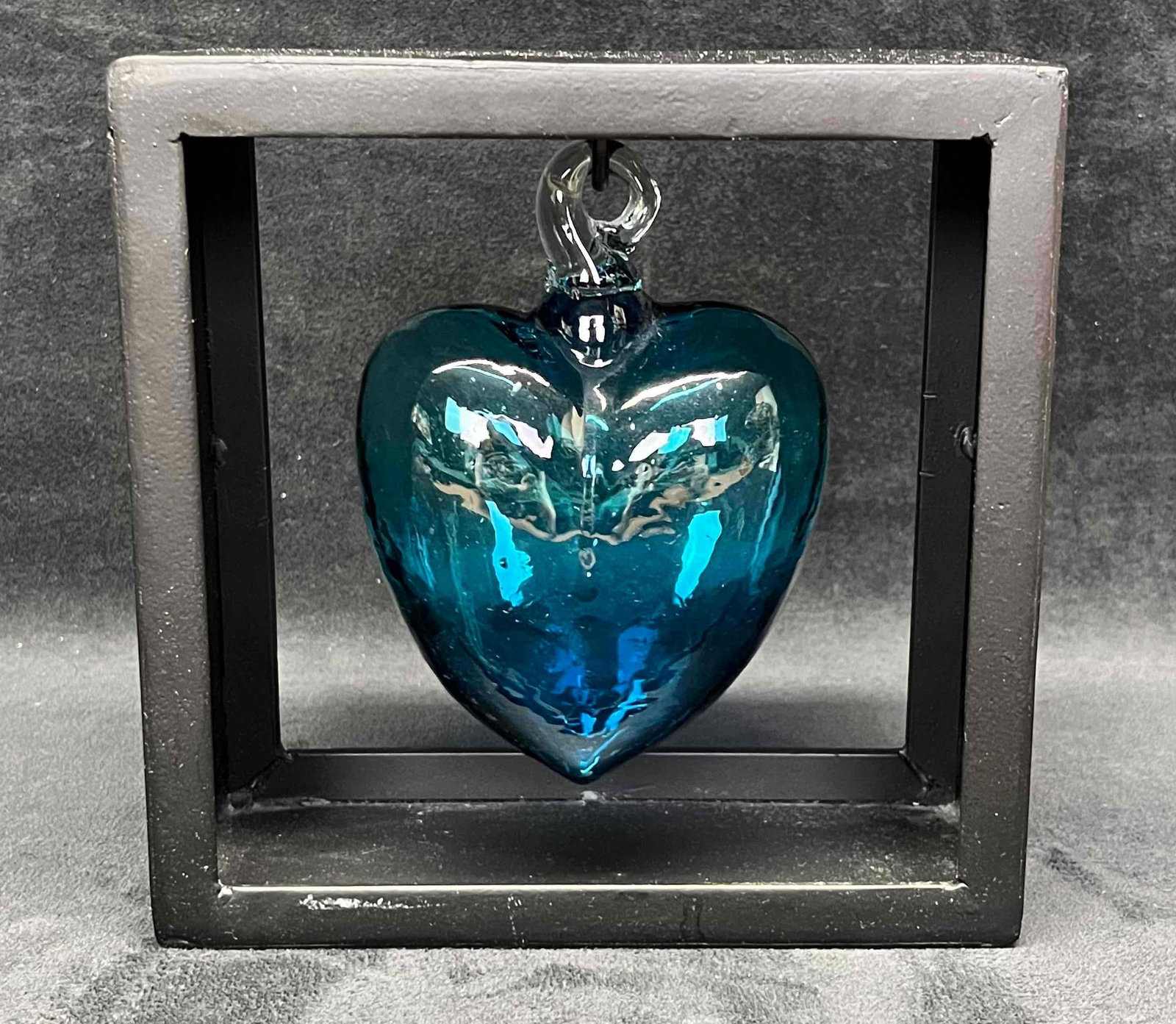 Hand Blown Glass Heart In A Box: This lot contains a Hand Blown Glass Heart In A Box. It is approx 7 14" x 3" x 7 1/4". Total weight is 2.5lbs. Overall the Decorative Art Glass is in good used condition with some light we