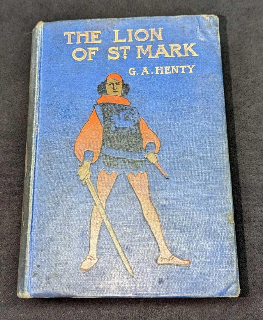 G.A. Henty The Lion Of St Mark Hardcover Book: G.A. Henty The Lion Of St Mark Hardcover Book. This was published by Blackie And Son Limited (London). No year is given, but this was probably published in the late 1800s/very early 1900s. The hardcov