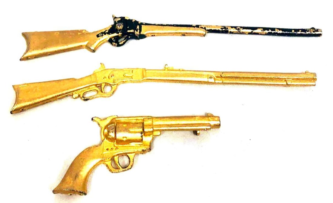 Set Of 3 Decorative Mini Guns One Pistol & Two Rifles: This lot contains a set of 3 Decorative Mini Guns one Pistol & two Rifles. The pistol is approx 2 1/4" x 1", the first rifle with some fading is approx 4 3/4" x 1/2" and the last r