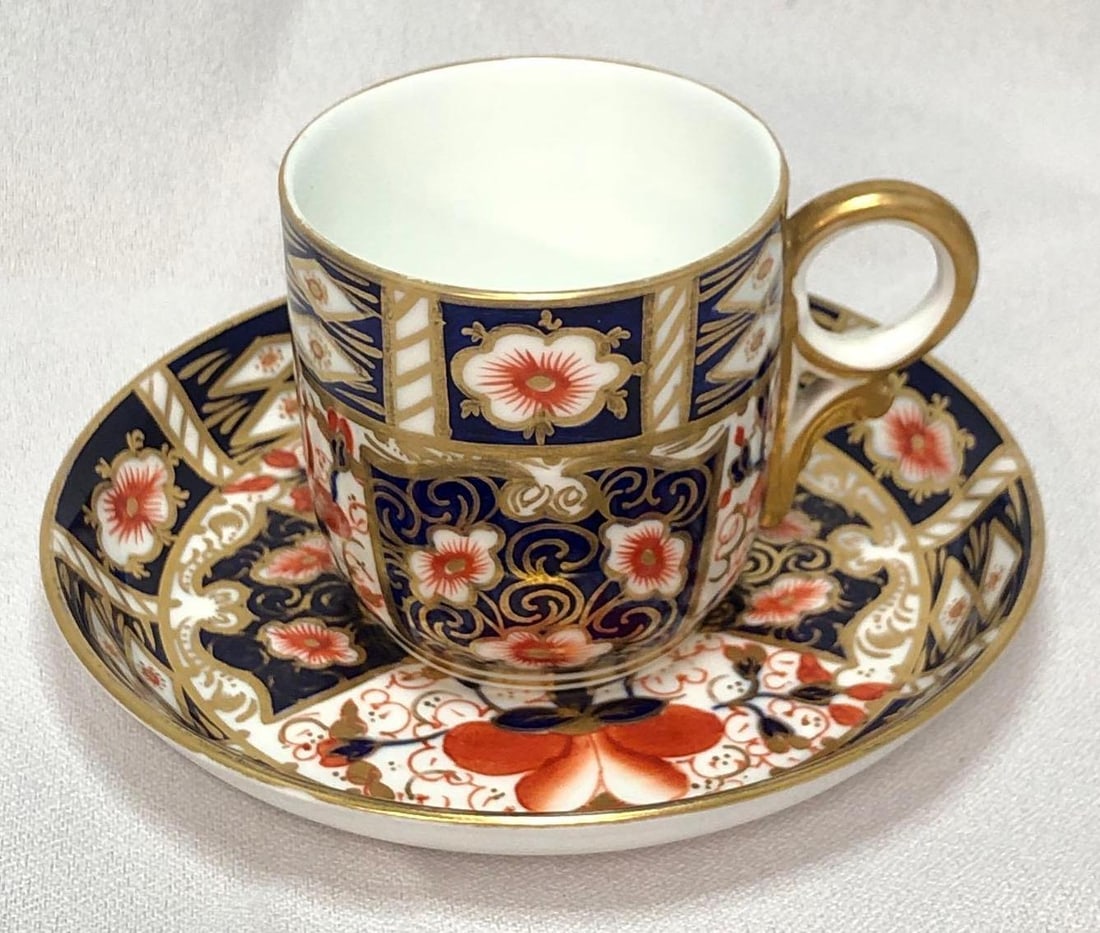 Antique Crown Derby Traditional Imari Cup Saucer: This lot contains Antique Crown Derby "Traditional Imari" Pattern 2451 Breakfast Cup (year mark 1910) and Saucer (year mark 1907). Decorated in iron red, cobalt blue and 22 carat gold with scr